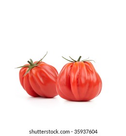 Two Fresh And Tasty Looking Heirloom Tomatoes On White Background