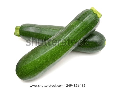 Two fresh zucchini market; squash on white
