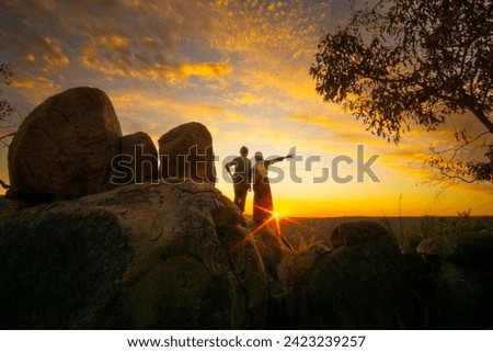 Two friend enjoy the beautiful sunset in Avon Valley National Park, Perth, Western Australia
