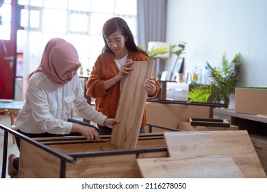 Two Friend Helping Each Other Making New Furniture