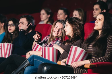 Two friends in the cinema on comedy - Powered by Shutterstock