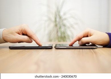 Two Friends Are Connecting And Sharing Files Over Smart Phones