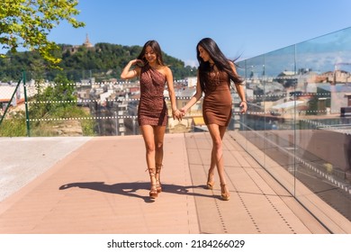 Two Friends Enjoying Summer Vacations In A Viewpoint Of The City