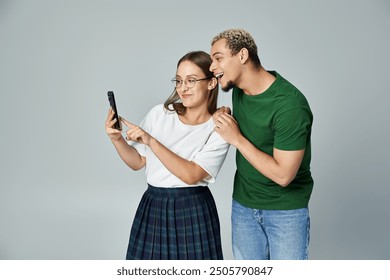 Two friends happily enjoying a lighthearted selfie moment together. - Powered by Shutterstock