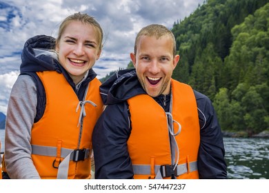 Two Friends Having Fun On Sunny Day In Boat, Norway