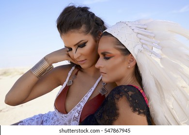 Two Friends Having A Moment In Burning Man Desert Warrior Outfits