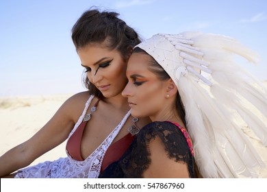 Two Friends Having A Moment In Burning Man Desert Warrior Outfits