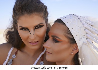 Two Friends Having A Moment In Burning Man Desert Warrior Outfits