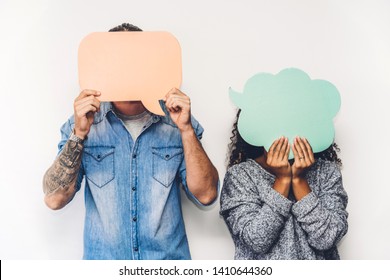 Two friends holding a speech bubble icon together - Shutterstock ID 1410644360
