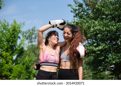 Two Friends Hugging And Laughing After A Muay Thai, Boxing, Kickboxing Match.