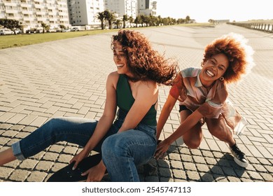 Two friends laugh and ride a skateboard together on a sunny day, enjoying fun and friendship in an urban environment. - Powered by Shutterstock