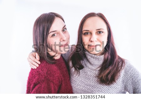 Similar – Image, Stock Photo Twin sisters stand laughing back to back in front of a stone wall