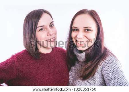 Similar – Image, Stock Photo Twin sisters stand laughing back to back in front of a stone wall