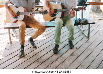 Two Friends Playing Guitars.