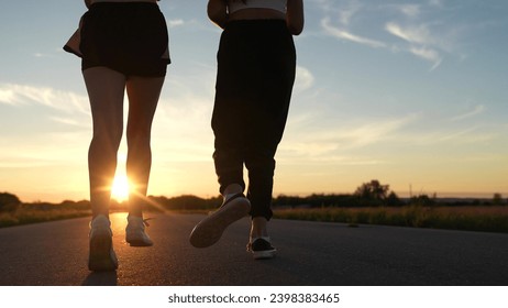 two friends running sunset, team group girls running sunset, silhouette athletic girls, teamwork running training sunset. runner silhouette, mixed race, treadmill sunset, athletic body, club like