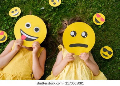 Two friends with sad sad and tired showing tongue emoticons. 