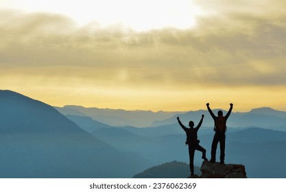 Two Friends Sharing Happiness at the Summit