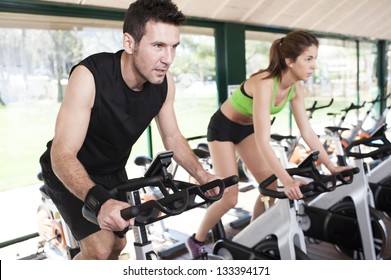 Two Friends Are In A Spinning Class At Gym