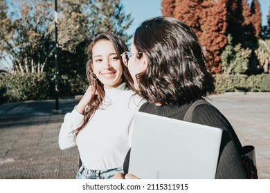 Two Friends Studying Together At University Campus Walking Going To Class While Smiling And Chit Chat. New Normal Lifestyle Concept With Young People Going To School. Motion Image Concept