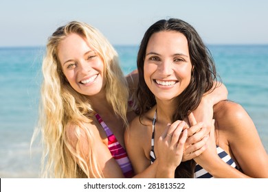 Two Friends In Swimsuits At The Beach