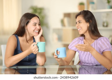 Two friends talking drinking coffee at home - Powered by Shutterstock