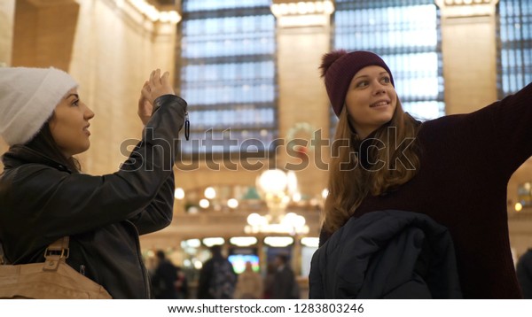 Two friends travel to New York for\
sightseeing - NEW YORK / USA - DECEMBER 4,\
2018