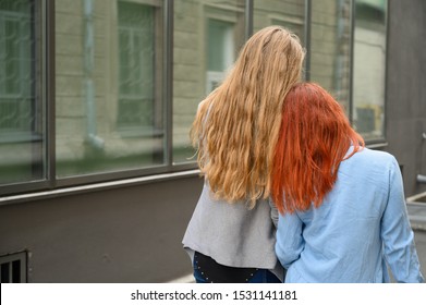 mature red head with friend