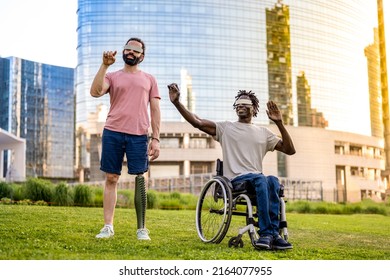two friends who have a different disability using modern technology headsets, trying virtual reality outdoors, modern skyscrapers as background - Powered by Shutterstock