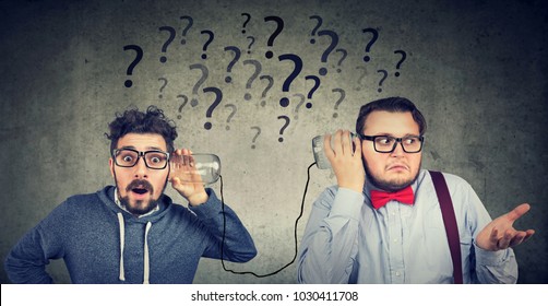 Two funny looking men having troubled communication 