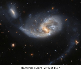 Two galaxies interacting NGC 5996 and NGC 5994. - Powered by Shutterstock