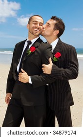 Two Gay Grooms Kissing.  Men In Suits.