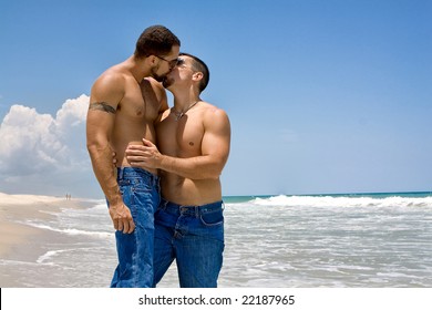 Two gay man standing at the ocean, kissing