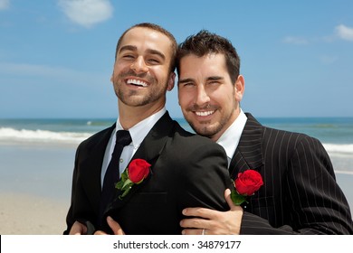 Two gay men after wedding on a beach