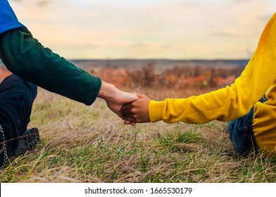 Two Gay Men Holding Hands Together And Being In Love, Different Race