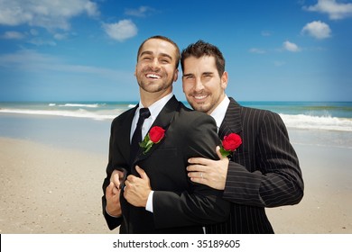 Two Gay Men Looking Into Camera After A Wedding Ceremony