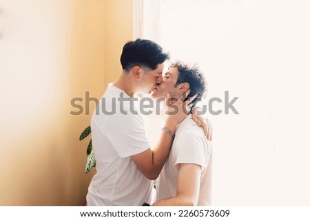 Similar – Young couple kissing in a studio portrait