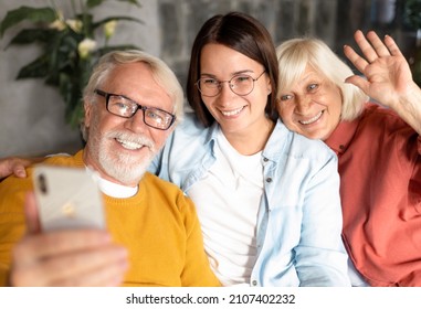 Two Generation Family Happy Elderly People With Adult Daughter Happily Take A Selfie Or Talking To Relatives Via Video Call Using A Mobile Phone