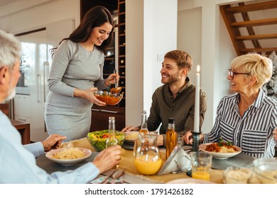 Two generational family having lunch together at home - Shutterstock ID 1791426182