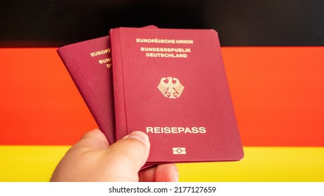 Two German passport in male hand on check in. Concept Idea - Shutterstock ID 2177127659