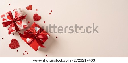 Two gift box wrapped in red and white with heart motifs sits on a soft banner backdrop, inviting romance and celebration. Perfect for valentines, love, gift, and affection themes