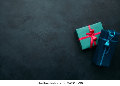 Two Gift Boxes On Dark Background. Problem Of Choosing A Perfect Gift For A Man. A Worthy Reward Concept