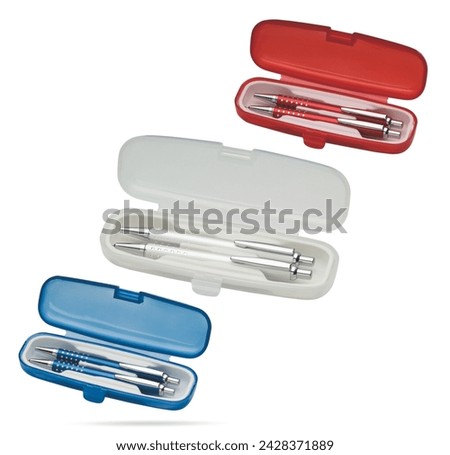 Two gift pens in classy, opened soft plastic pencil box. Gift box packaging for promotional branding. Promotional gift twin pens in box. Transparented white, blue and red colored pens.