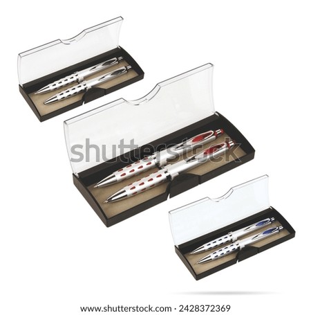Two gift pens in classy, opened transparent plastic pencil box. Gift box packaging for promotional branding. Promotional gift twin pens in box. Silver, blue and red colored pens.