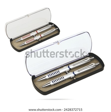 Two gift pens in classy, opened transparent plastic pencil box. Gift box packaging for promotional branding. Promotional gift twin pens in box. Silver, blue and red colored pens.