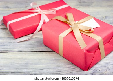 Two gifts wrapped in pink paper close-up. A gift for a loved one. - Powered by Shutterstock