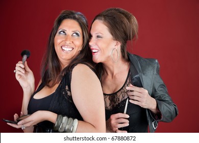 Two Giggling Cougars Dressed In Black Prepare Their Makeup