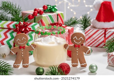 Two gingerbread men holding a glass of milk. The scene is set in a festive atmosphere with Christmas decorations and presents - Powered by Shutterstock