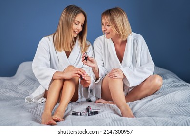 Two Girl Friends Or Couple In Bedroom Having Fun