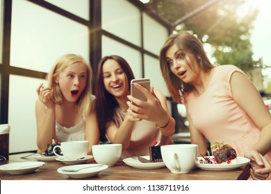 Two girl friends spending time together drinking coffee in the cafe, having breakfast and dessert. Youth, lifestyle, communication concept - Shutterstock ID 1138711916