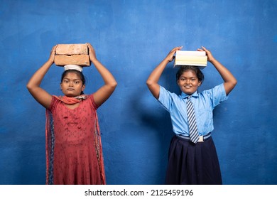 Two girl kids with books and bricks on each other head looking at camera - concept poverty and conflict or necessary between education and child labour.